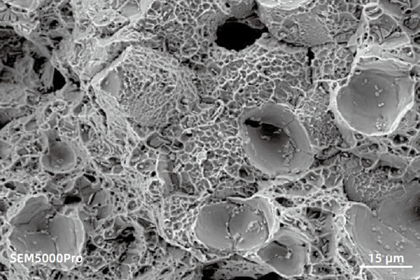 sem image analysis 10 kV imaging with Everhart-Thornley Detector (ETD) used to  characterize the fracture surface of iron-nickel alloy metal.